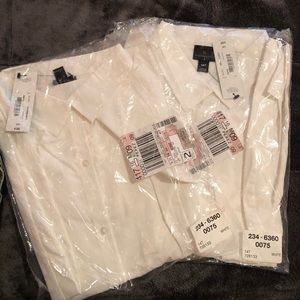 Two women’s button up dress shirts